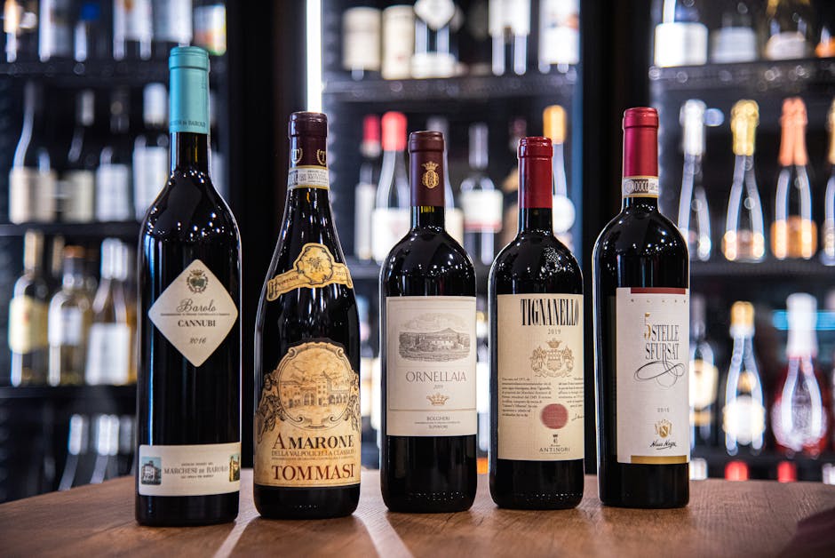 A premium collection of Italian red wines elegantly displayed in a wine store setting.