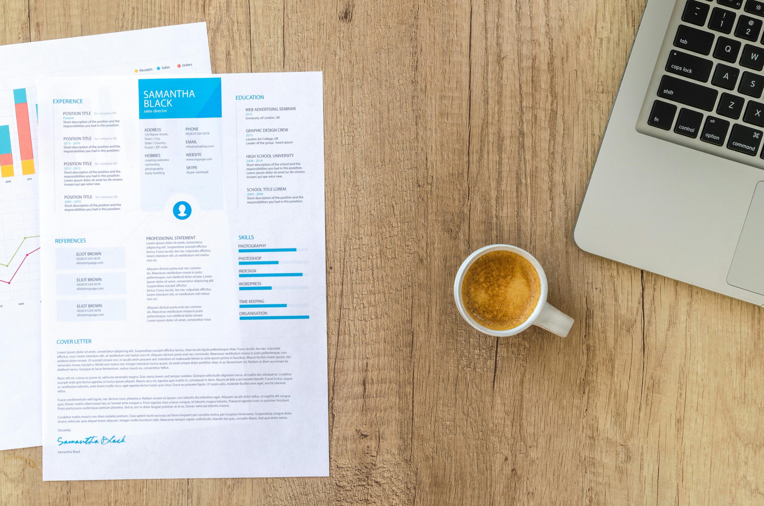 Homepage Cyriel Top view of a desk with resume, coffee cup, and laptop on a wooden surface, ideal for business concepts.